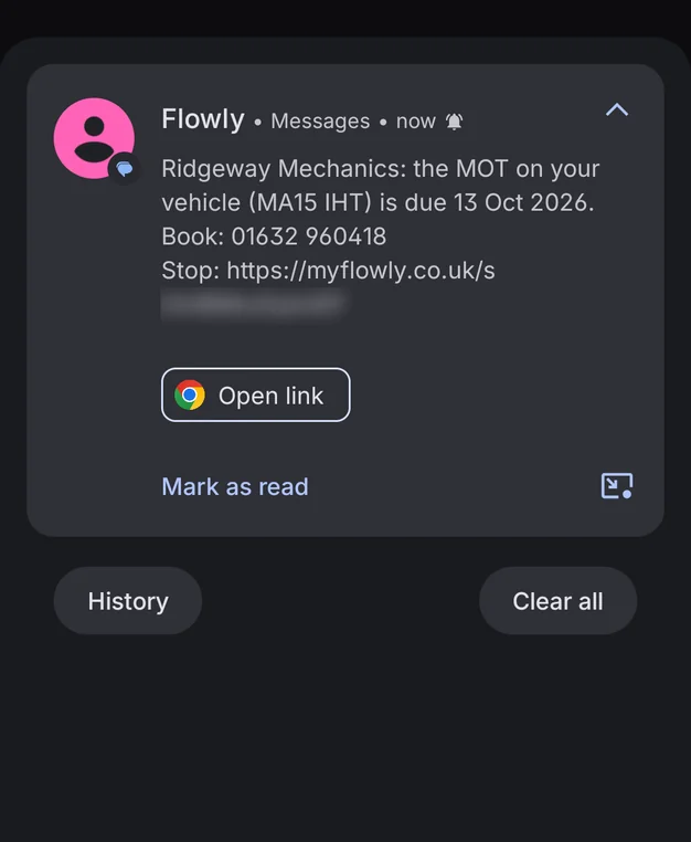 The MOT reminder text on the customer's phone: Ridgeway Mechanics, the MOT on your vehicle (MA15 IHT) is due 13 Oct 2026, with the garage's number and a stop link